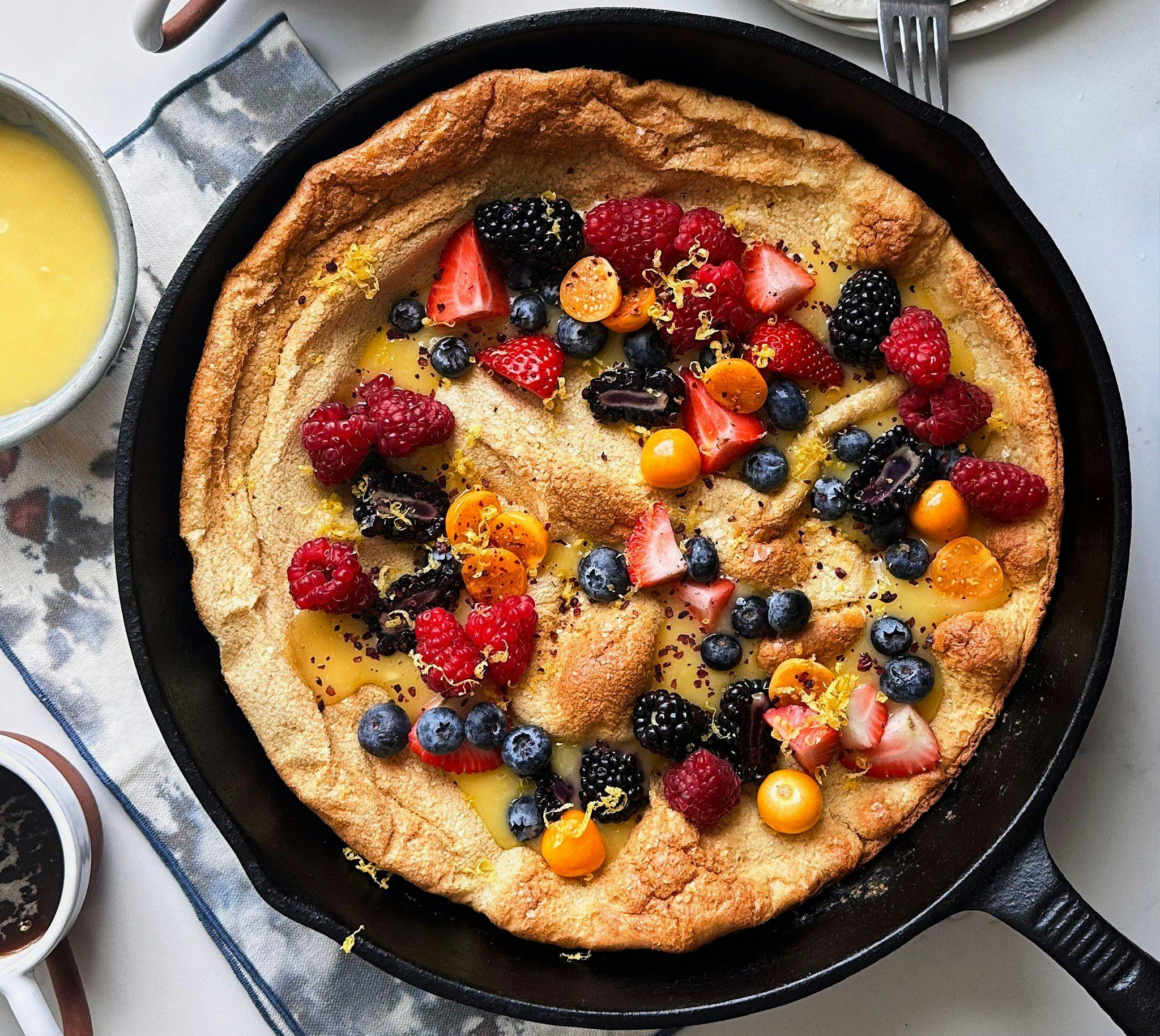Dutch Baby in Skillet with Berries and Lemon Curd
