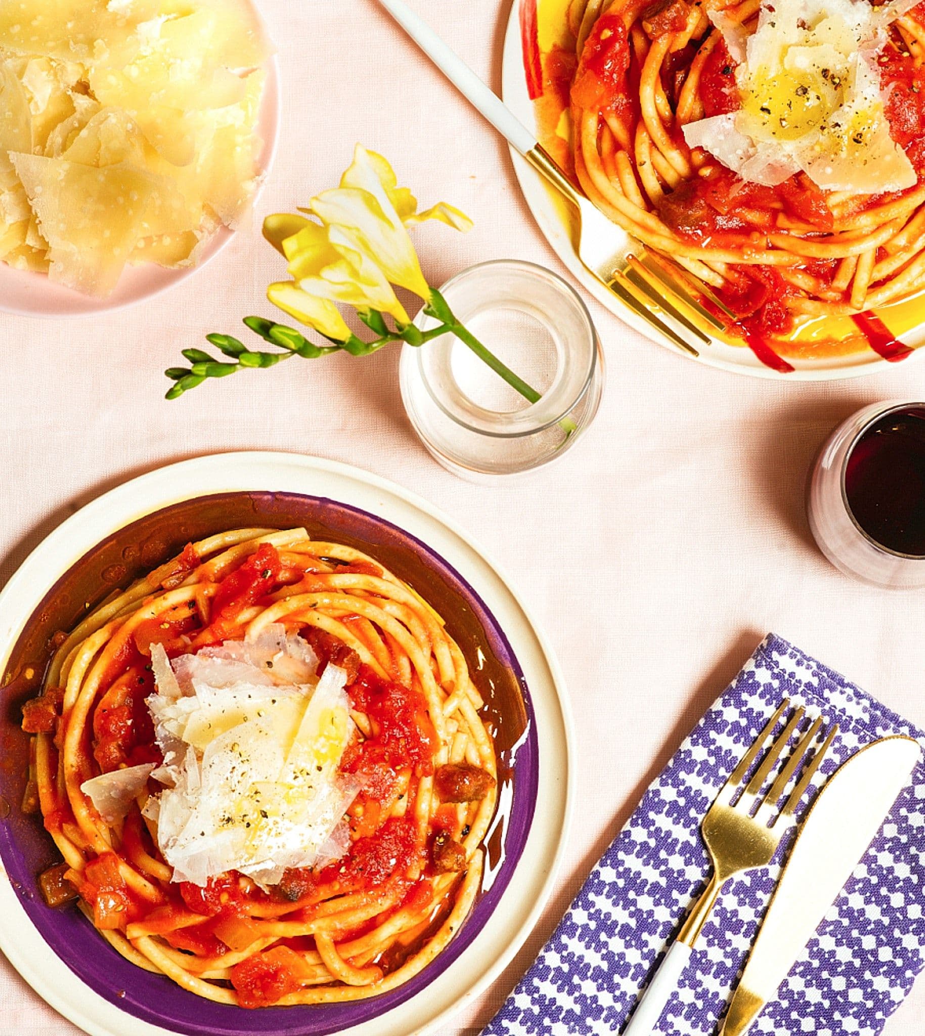 table setting with 2 plates of Bucatini all’Amatriciana