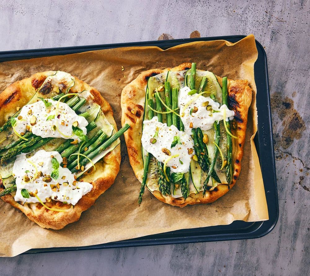 Two pizzas on a pan