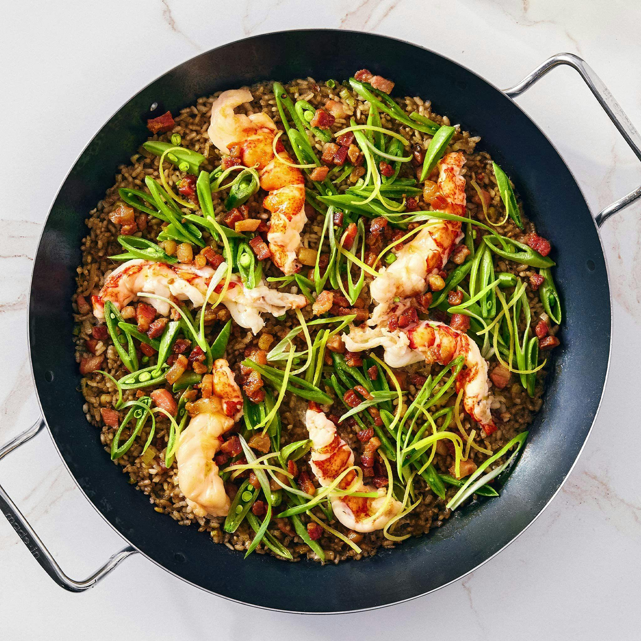 Lobster Paella in Pan with Snap Peas and Scallions