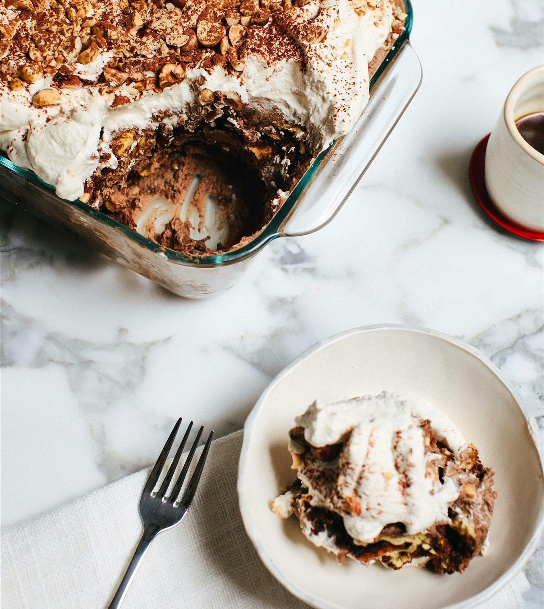 Serving dish of Coffee Hazelnut Trifle and one plate served with a fork