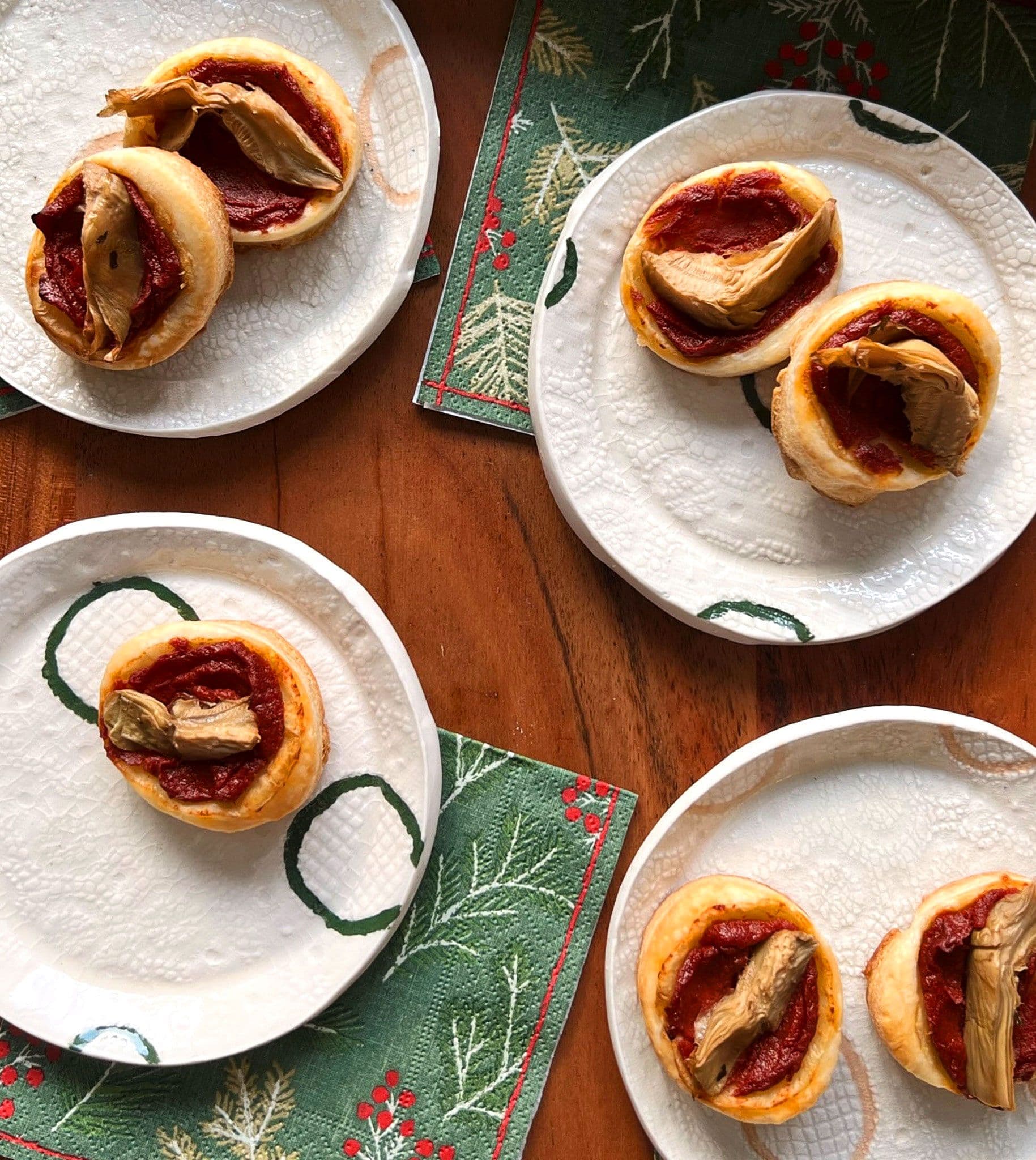 roman pizette on 4 white dishes